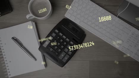 Animation-of-numbers-changing-over-desk-with-calculator-and-computer-keyboard