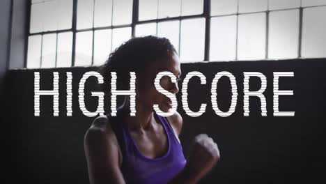 Animation-of-high-score-text-over-mixed-race-woman-jogging-indoors