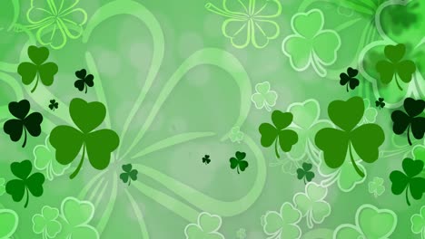 Animation-of-multiple-clover-leaves-on-green-background