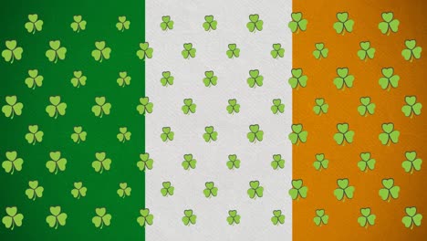 Digital-animation-of-multiple-clover-leaves-moving-against-irish-flag