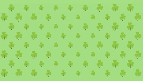 Digital-animation-of-multiple-clover-leaves-moving-against-green-background