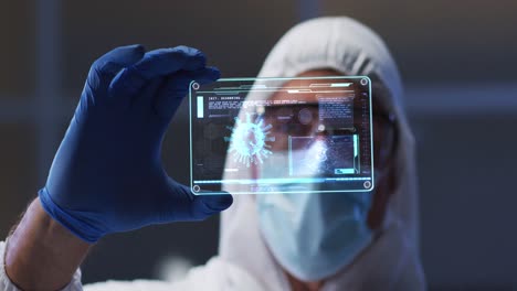 Animation-of-male-scientist-holding-digital-screen-with-covid-19-cell
