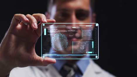 Animation-of-male-scientist-holding-digital-screen-with-covid-19-cell