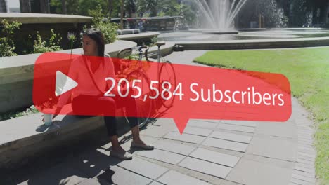 Animation-of-subscribers-text-with-numbers-changing-over-woman-using-smartphone-in-park