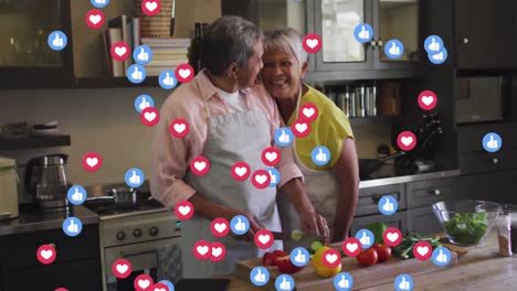 Animationssymbole-Für-Soziale-Medien-Wie-Und-Liebe-über-Ein-älteres-Paar,-Das-Gemeinsam-In-Der-Küche-Kocht