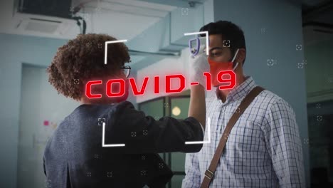 Animation-of-covid-19-cells-text-over-man-having-temperature-checked-in-office-wearing-face-mask