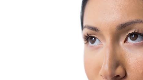 Close-up-of-asian-woman-eyes-against-white-background