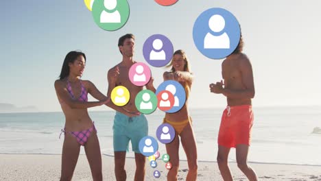 Multiple-profile-icons-floating-against-group-of-friends-dancing-on-the-beach