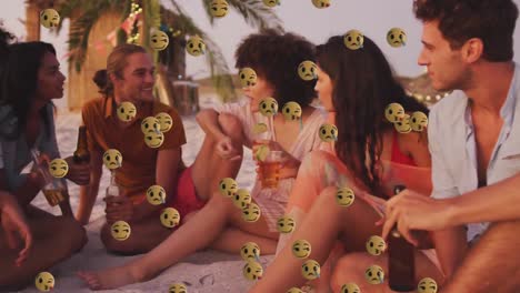 Emojis-Mit-Mehreren-Gesichtern-Schweben-Vor-Einer-Gruppe-Von-Freunden,-Die-Am-Strand-Etwas-Trinken