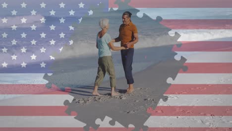 Animation-of-american-flag-jigsaw-puzzle-revealing-confetti-and-senior-couple-dancing-on-beach