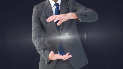 Animation-of-glowing-spot-of-light-between-businessman-hands-on-grey-background
