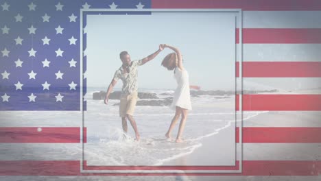 Animation-of-american-flag-waving-over-man-and-woman-dancing-on-beach