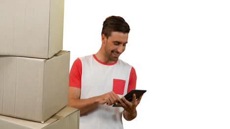 Animation-of-man-using-tablet-with-stacks-of-boxes-on-white-background