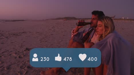 Animation-of-people,-thumbs-up-and-love-icons-and-numbers-over-couple-drinking-beer-on-beach