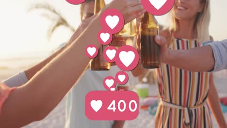 Animation-of-heart-icons-and-numbers-over-friends-making-toast-with-beer-bottles-on-beach
