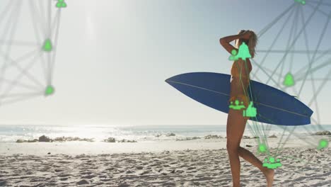 Animation-of-networks-of-connections-with-icons-over-woman-with-surfboard-on-beach