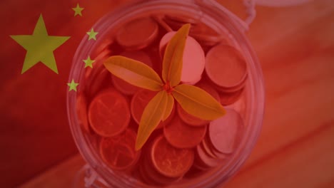 Animation-of-chinese-flag-waving-over-plant-in-jar-full-of-coins