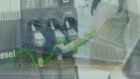 Animation-of-financial-data-processing-with-green-line-over-woman-in-petrol-station