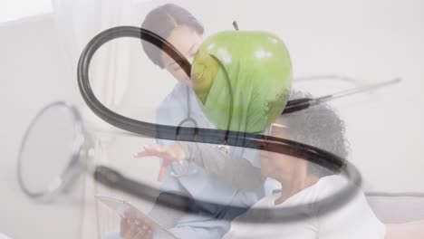 Animation-of-stethoscope-and-green-apple-over-female-doctor-with-senior-woman-smiling