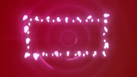 Animation-of-fairy-lights-forming-rectangular-frame-with-copy-space-on-pulsating-pink-circles