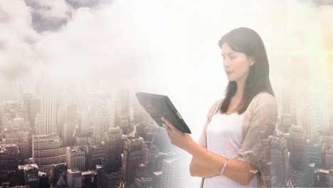 Animation-of-businesswoman-using-tablet-over-cityscape