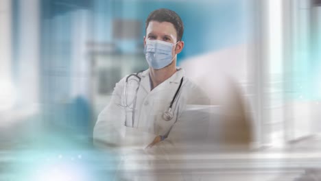 Animation-of-portrait-of-male-doctor-wearing-face-mask