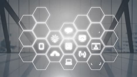 Animation-of-network-of-hexagons-with-icons-over-modern-office-in-background