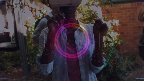 Animation-of-scope-scanning-over-woman-wearing-vr-headset-and-moving-her-hands