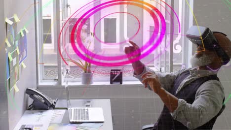 Light-trails-over-scope-scanner-against-african-american-senior-man-wearing-vr-headset-at-office