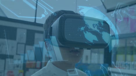 Animation-of-globe-spinning-and-processor-elements-over-schoolboy-wearing-vr-headset