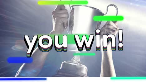 Animation-Von-„Sie-Gewinnen“-Text-In-Regenbogenfarbenen-Buchstaben-Und-Streifen-über-Einem-Mann,-Der-Einen-Silbernen-Pokal-Hält