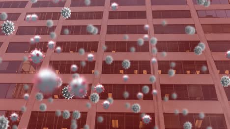 Animation-Von-Covid-19-Zellen,-Die-über-Einem-Bürogebäude-Auf-Rotem-Hintergrund-Schweben