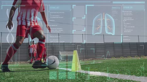 Digital-interface-with-medical-data-processing-against-male-soccer-player-training-on-grass-field