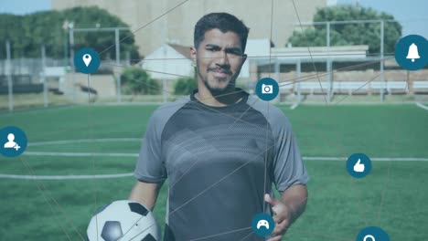Network-of-connections-against-portrait-of-male-soccer-player-holding-soccer-ball-on-grass-field