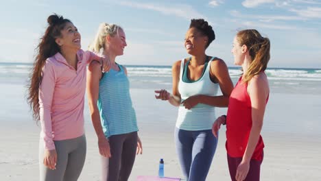 Happy-group-of-diverse-female-friends-having-fun-at-the-beach