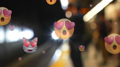 Animation-of-multiple-emoji-icons-with-heart-eyes-over-out-of-focus-train-in-background