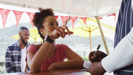 African-american-woman-ordering-food-at-the-food-truck