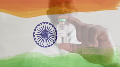 Animation-Eines-Männlichen-Arztes,-Der-Eine-Impfflasche-über-Der-Indischen-Flagge-Hält