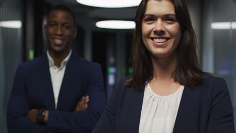 Portrait-of-smiling-diverse-businesswoman-and-businessman-in-modern-office