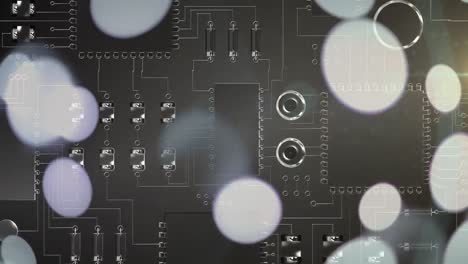 Animation-of-white-spots-of-light-over-computer-circuit-board