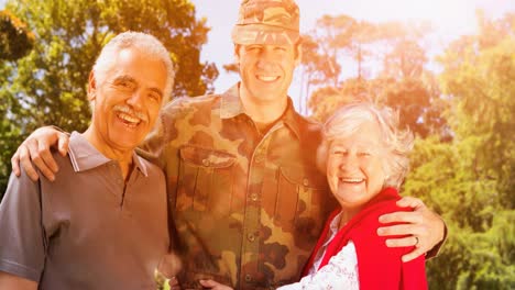 Animation-of-male-soldier-embracing-smiling-parents-over-american-flag