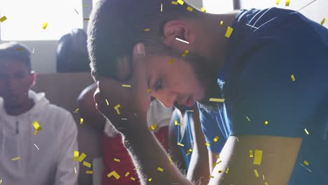 Animation-of-confetti-falling-over-tired-football-player-in-changing-rooms