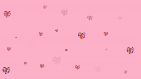 Animation-of-flowers-moving-in-hypnotic-motion-on-pink-background
