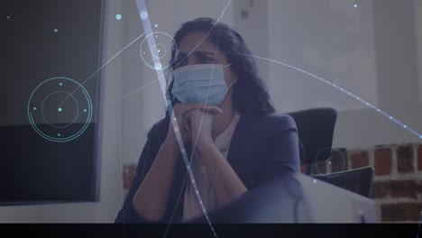 Animation-of-network-of-connections-over-worried-businesswoman-wearing-face-mask-in-office