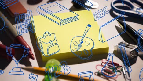 Animation-of-blue-doodles-of-school-equipment-scrolling-over-stationery-on-desk