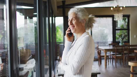 Senior-mixed-race-woman-talking-on-smartphone