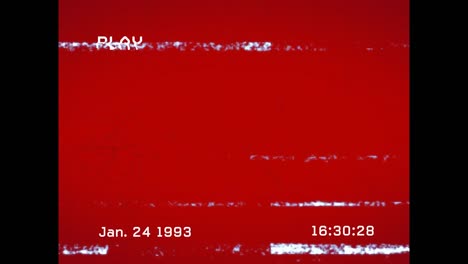 Animation-of-play-digital-interface-text-with-glitch-on-red-background