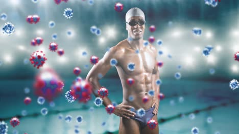 Covid-19-cells-floating-against-african-american-male-swimmer-against-swimming-pool