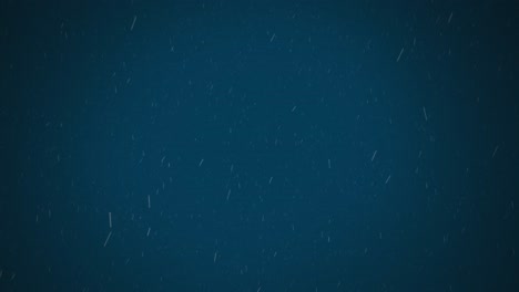 Digital-animation-of-white-particles-falling-against-blue-background