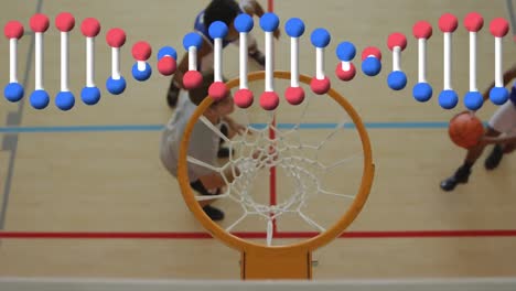 Dna-structure-spinning-against-overhead-view-of-group-of-boys-playing-basketball